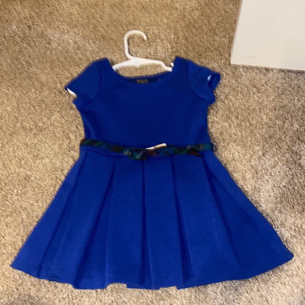 Pleated blue dress with plaid belt